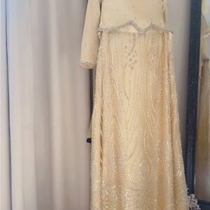 Elegant Cream Wedding Dress with Beaded Details